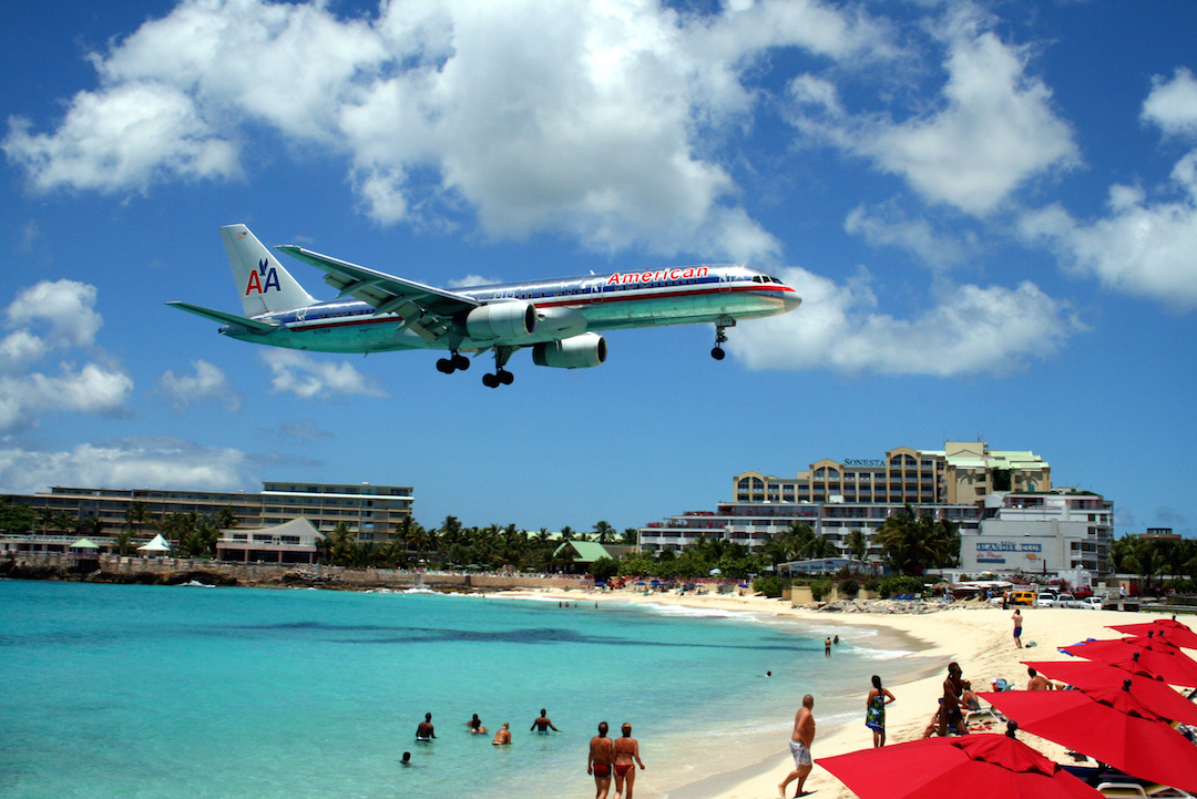 plane-flying-over-beach-st-marteen